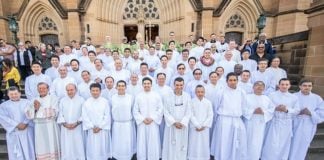 Archbishop Anthony Fisher OP with more than 50 newly installed acolytes at St Mary’s Cathedral. Photo: Giovanni Portelli