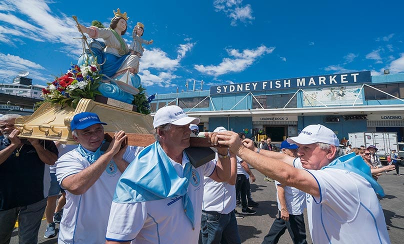 The replica Madonna, Santa Maria Di Porto Salvo (Our Lady of Safe Harbour), guardian of seafarers and fishermen, is processed through the Sydney Fish Markets. Photo: Patrick Lee