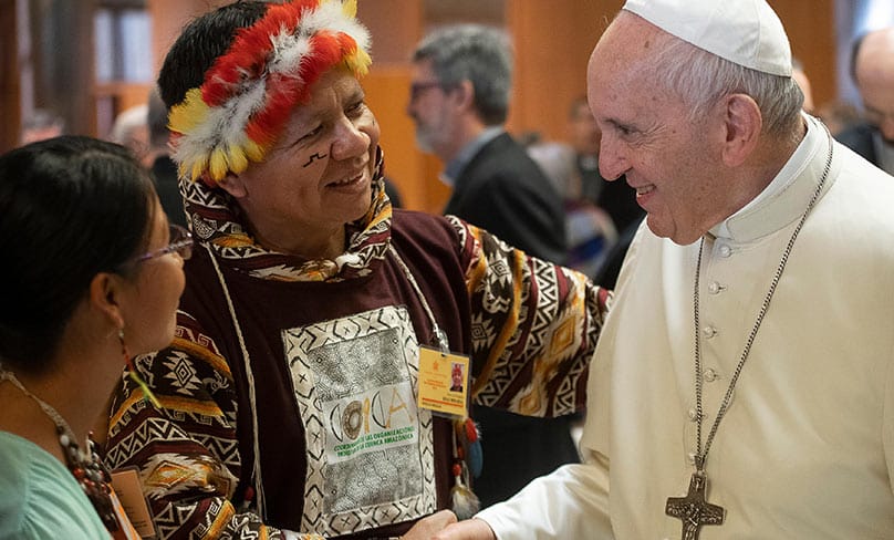 Pope Francis greets people during the Synod of Bishops for the Amazon at the Vatican. Photo: CNS photo/Vatican Media