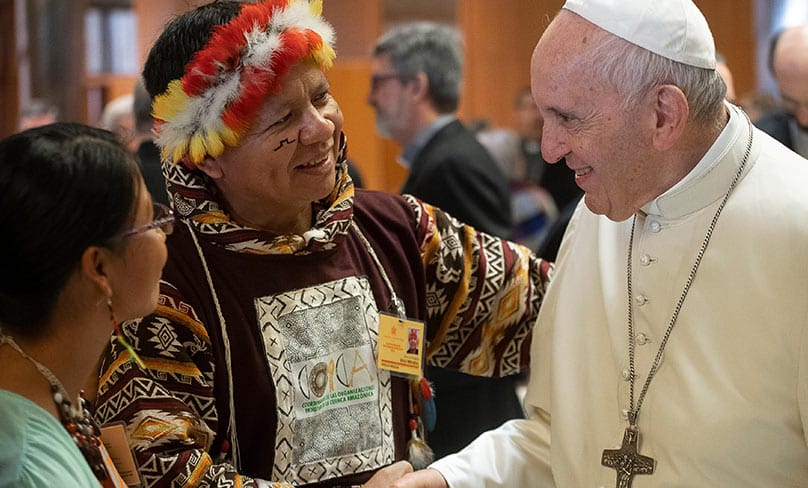 Pope Francis greets people during the Synod of Bishops for the Amazon at the Vatican. Photo: CNS photo/Vatican Media