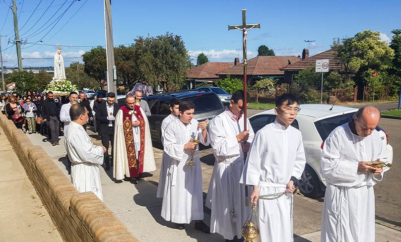 Punchbowl Parish Priest Fr Joseph Gedeon leads a Marian procession on 13 October. Photo: Mathew De Sousa