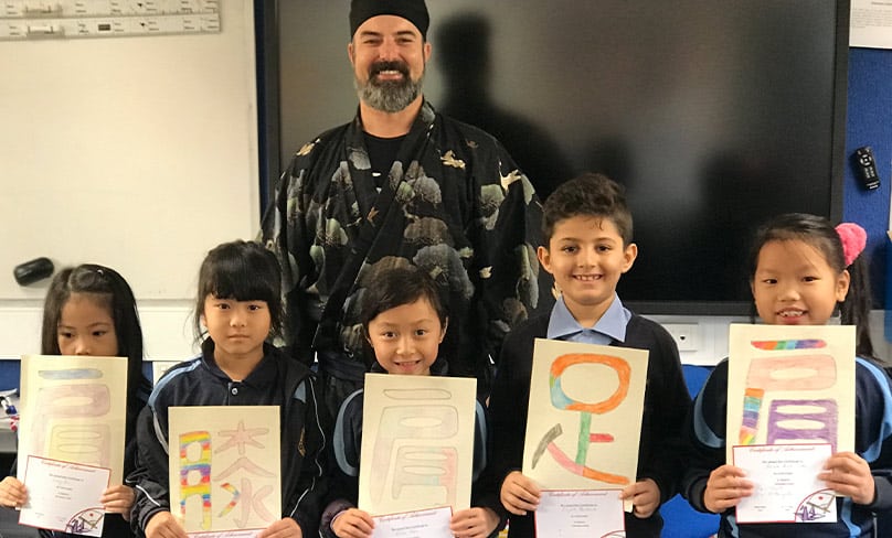 Japanese Language teacher Peter White with some of his students.