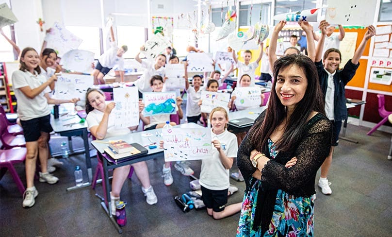 The Year 6 students from Arncliffe’s St Francis Xavier's Catholic Primary School are putting the finishing touches on their banners which they’ll hold proudly as they walk With Christ this weekend. Photo: Alphonsus Fok