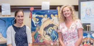 Maro Giannakopoulos from Our Lady of Lourdes Primary School, Earlwood, with her award winning artwork titled “Behold, O Heaven and Earth. Your King is Here”, Photo: Giovanni Portelli