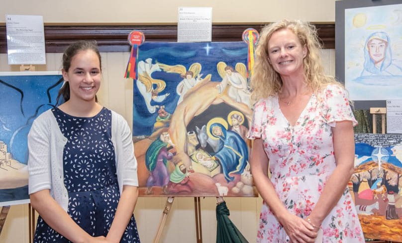Maro Giannakopoulos from Our Lady of Lourdes Primary School, Earlwood, with her award winning artwork titled “Behold, O Heaven and Earth. Your King is Here”, Photo: Giovanni Portelli