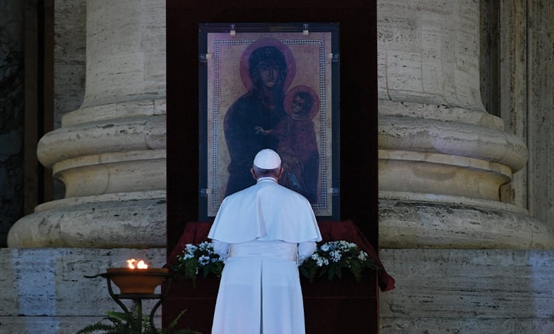 Pope Francis prays in front of the Marian icon, “Salus Populi Romani” at the Vatican on 27 March. Photo: CNS photo/Vatican Media