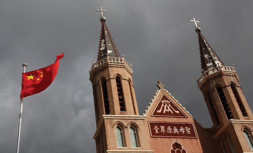 The Chinese national flag flies in front of a Catholic church in Huangtugang, China, Sept. 30, 2018. Photo: CNS photo/Thomas Peter, Reuters