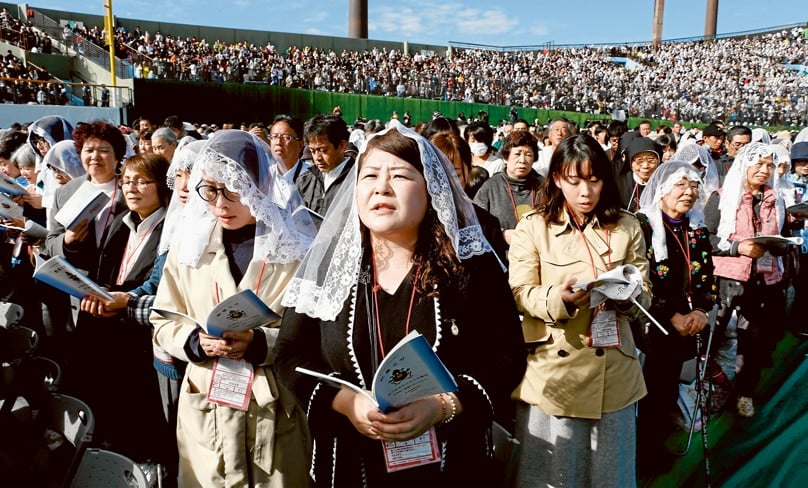 People attend Pope Francis’ celebration of Mass at the baseball stadium in Nagasaki, Japan. PHOTO: CNS/PAUL HARING