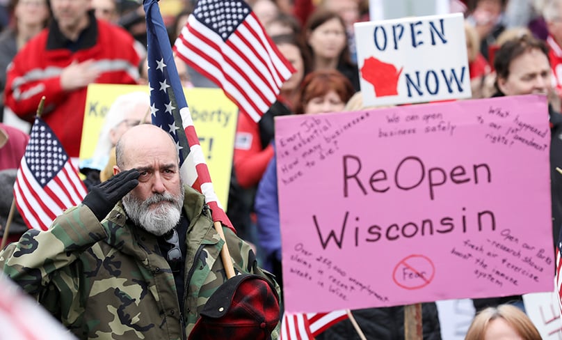 Demonstrators in Madison, Wis., protest the state's extended stay-at-home order to help slow the spread of the coronavirus April 24, 2020. Photo: CNS/Daniel Acker, Reuters