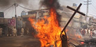 A demonstrator burns a cross during a protest in the Badami Bagh area of Lahore, Pakistan, in 2013. Photo: CNS, Adrees Hassain, Reuters