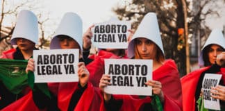 Women dress as Handmaids at a protest calling for abortions to be legal in Santa Fe, Argentina. Photo: Agustina Girardo/Wikimedia Commons, CC BY-SA 4.0