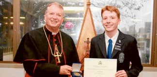 Gabriel Brady from St Mary’s Cathedral College is seen here being presented his Archbishop’s Award by Archbishop Anthony Fisher OP.