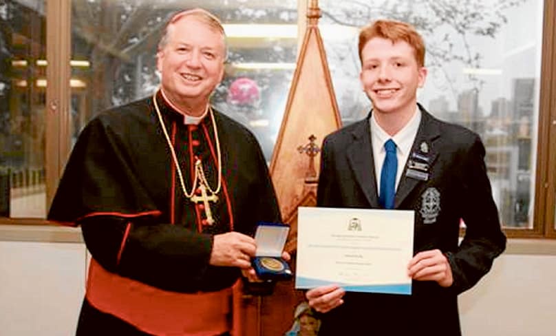 Gabriel Brady from St Mary’s Cathedral College is seen here being presented his Archbishop’s Award by Archbishop Anthony Fisher OP.