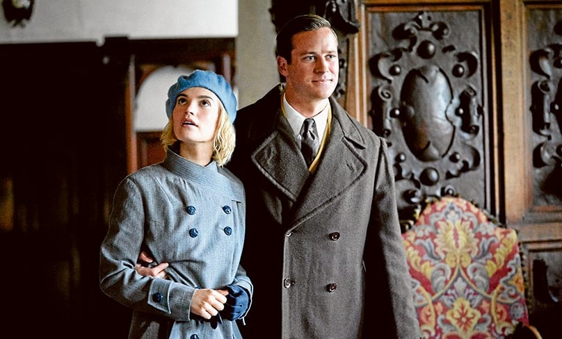 Lily James as Mrs de Winter, Armie Hammer as Maxim de Winter. Photo: Kerry Brown/NETFLIX