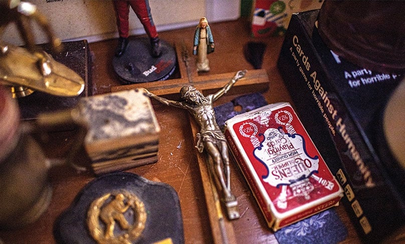 Some of his few treasured possessions include a crucifix and a statue of the Blessed Virgin Mary. Photo: Alphonsus Fok