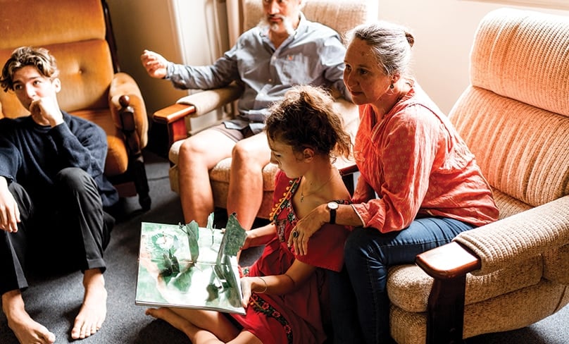 The Caron family at home in Berry. What seemed like a bad roll of the dice has turned into a positive and happy life-changing experience for the entire family. Photo: Michael Boyle Photography