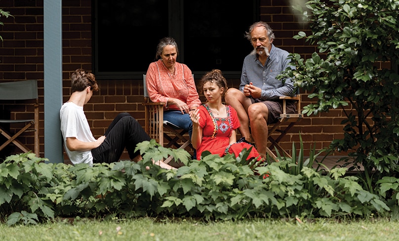 The Caron family at home in Berry. What seemed like a bad roll of the dice has turned into a positive and happy life-changing experience for the entire family. Photo: Michael Boyle Photography