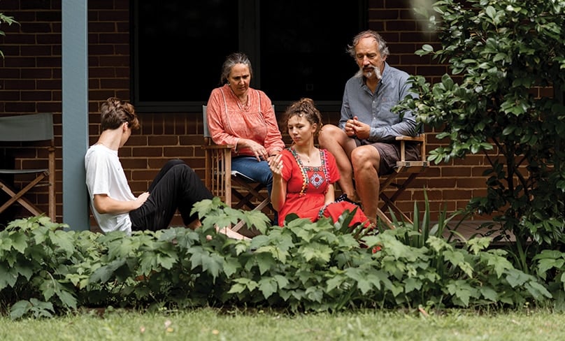 The Caron family at home in Berry. What seemed like a bad roll of the dice has turned into a positive and happy life-changing experience for the entire family. Photo: Michael Boyle Photography