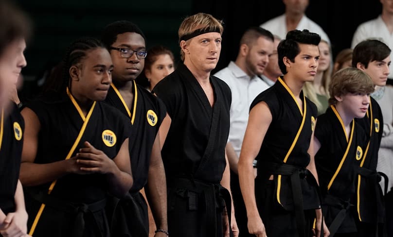 The Karate Kid’s Johnny Lawrence (William Zabko) makes a striking return to the All-Valley Karate Championships in Cobra Kai, now streamin all three seasons on Netflix.. Photo: Jace Downs/Netflix