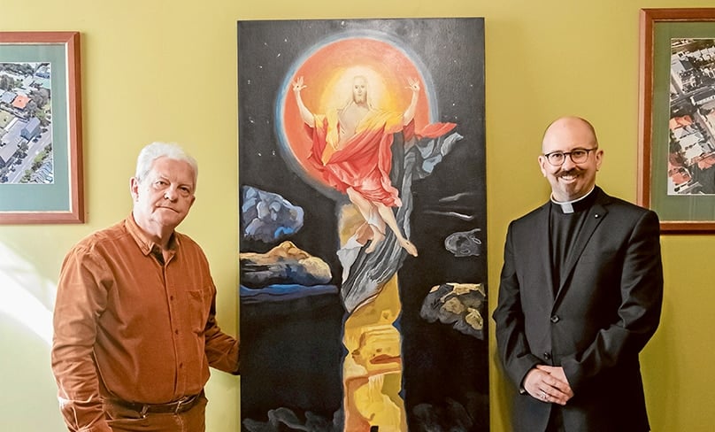 Artist Michael Galovic (at left) and Fr Paul Smithers who commissioned ‘The Crucifixion Subsumed’ for St Joseph’s Church, Rosebery. Photo: Giovanni Portelli