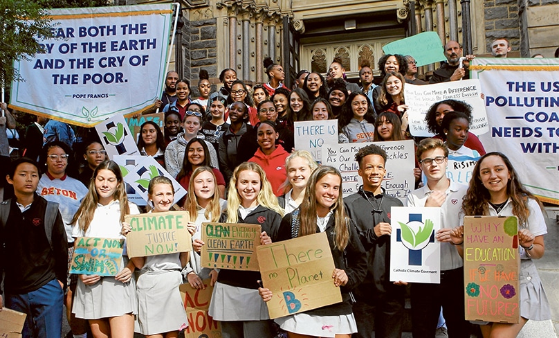 Students from Catholic schools in the Washington Archdiocese stand outside St Patrick’s Church in Washington in 2019 prior to the climate change rally at the US Capitol. Photo: CNS/Carol Zimmermann