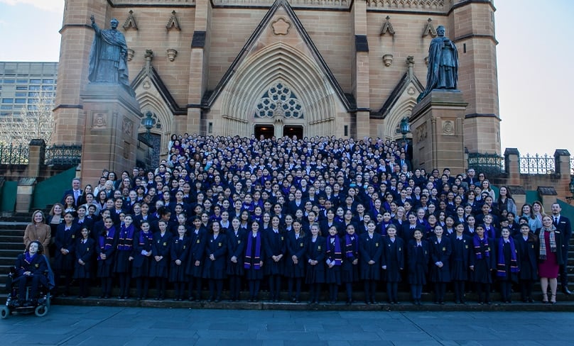 Bethlehem College students and staff gather outside St Mary's Cathedral after a Mass marking the school's 140th anniversary. Photo: Bethlehem College, Ashfield
