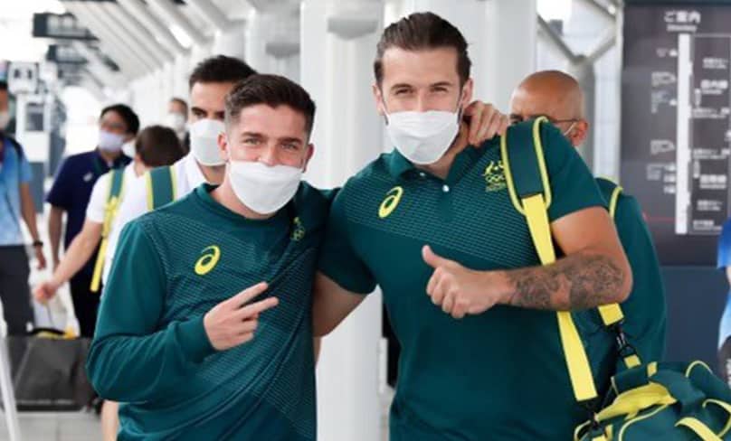 Masked and ready to go … Olyroos teammates Cameron Devlin and Jordan Holmes in Tokyo. Photo: Supplied