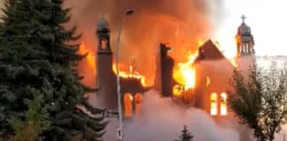 Flames engulf St Jean Baptiste Church in Morinville, Alberta, on 30 June in this still image taken from video obtained from social media. PHOTO: CNS photo/Diane Burrel, social media via Reuters