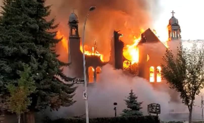 Flames engulf St Jean Baptiste Church in Morinville, Alberta, on 30 June in this still image taken from video obtained from social media. PHOTO: CNS photo/Diane Burrel, social media via Reuters