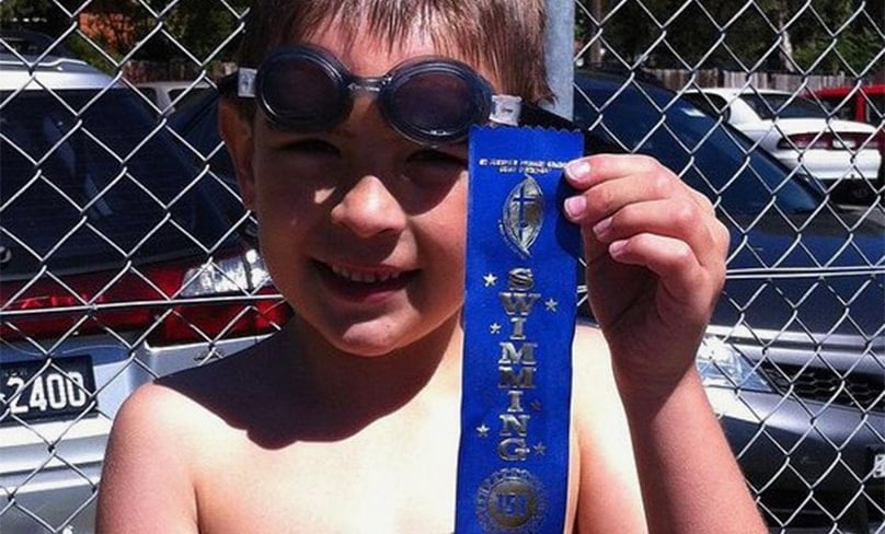 Blue ribbon standard: Alex winning his first race at his St Joseph’s Como swimming carnival. Photo: Supplied