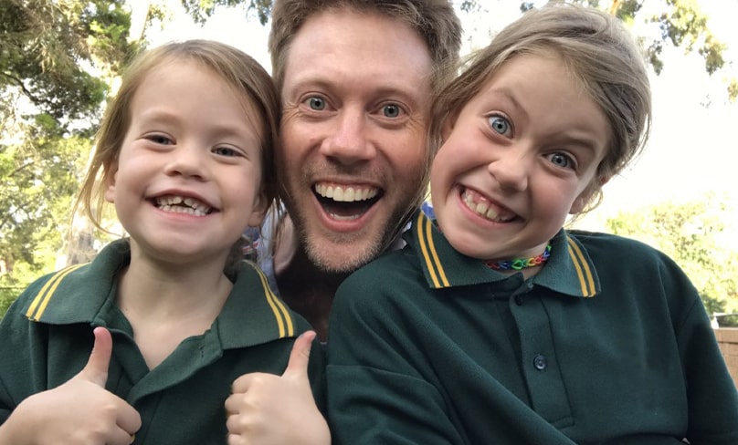Self-confessed Dad joke teller Adrian Beck with his long-suffering daughters Clara (left) and Olivia.