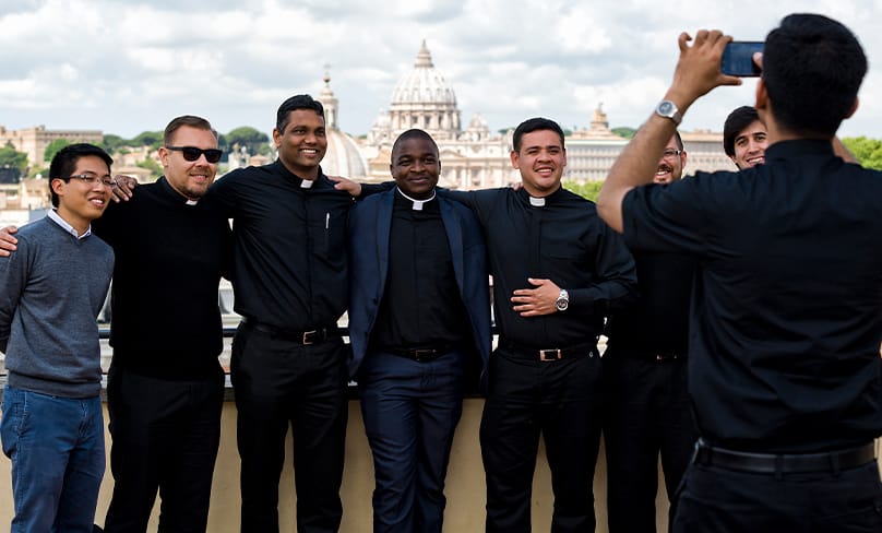 A group of friends, seminarians from all over the world, relax for a snapshot on the rooftop of the Pontifical University of the Holy Cross in Rome. Photo: PUHC