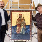 A delighted Fr Paul Smithers receives the completed icon of Our Lady Help of Christians from iconographer Michael Galovic. Photo: Alphonsus Fok