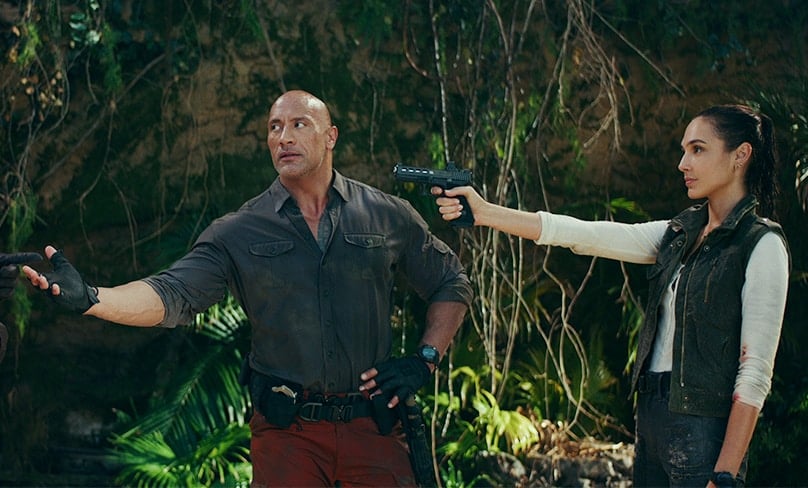 Red Notice. (L to R) Dwayne Johnson as John Hartley and Gal Gadot as The Bishop in Red Notice. Photo: Netflix