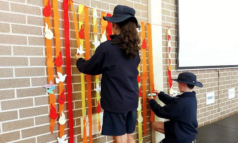 St Michael's Catholic Primary School Students decorate the school hall for the parish Pentecost party. Photo: St Michael's Catholic Primary School