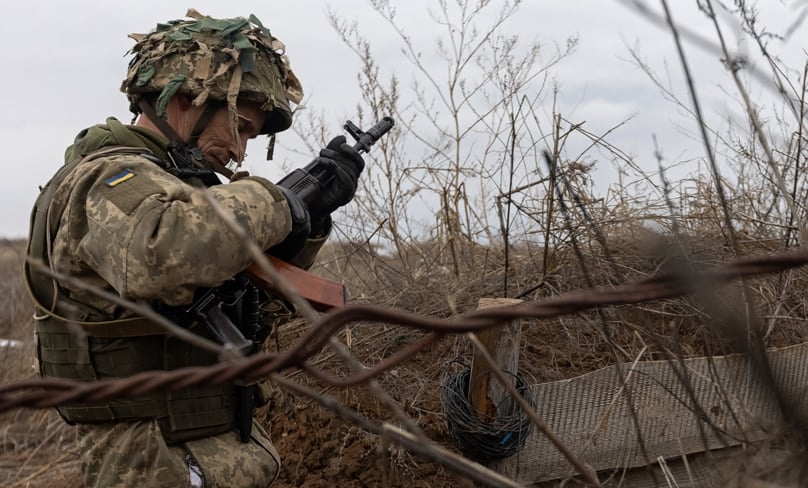 A member of the Ukrainian armed forces stands near the line of separation from Russian-backed rebels near Horlivka, Ukraine. Photos: CNS photo/Andriy Dubchak, Reuters