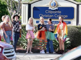 Supporters and members of the LGBTQI+ community stand outside Citipointe Christian College in Brisbane after the Christian College revised its student enrolment policy which included matters relating to gender and sexuality. Photo: AAP Image/Jono Searle