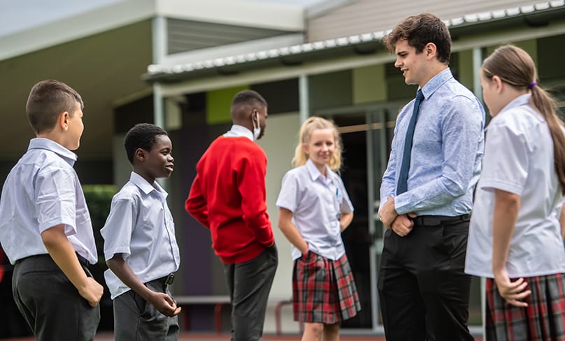 ACU student teachers with students at St Clare’s school in Hassall Grove. Photo: Giovanni Portelli