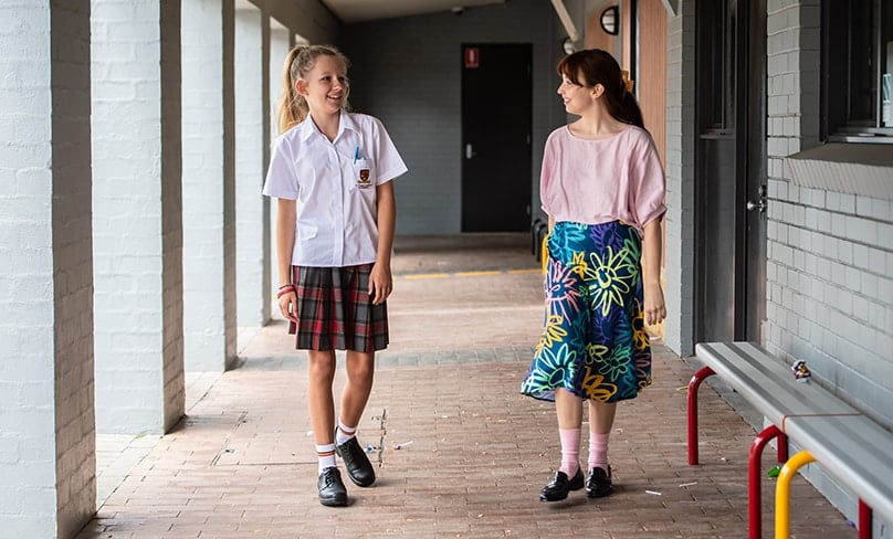 ACU student teachers with students at St Clare’s school in Hassall Grove. Photo: Giovanni Portelli