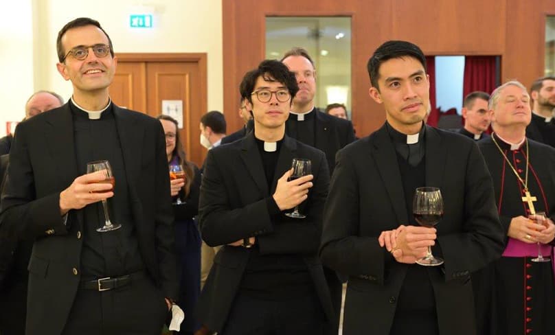 Fathers Luca Infantino (Archdiocese of Sydney), left, Michael Kong (Archdiocese of Melbourne) and Adi Indra (Diocese of Sandhurst) listen to speeches during the gathering. Photo: Courtesy Domus Australia