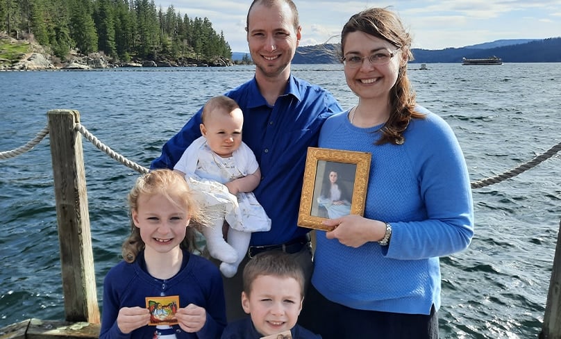 Julianna, at left, baby Gemma, dad Ben, son Justin and mum Chrissie, holding a portrait of Eileen. Photo: Supplied