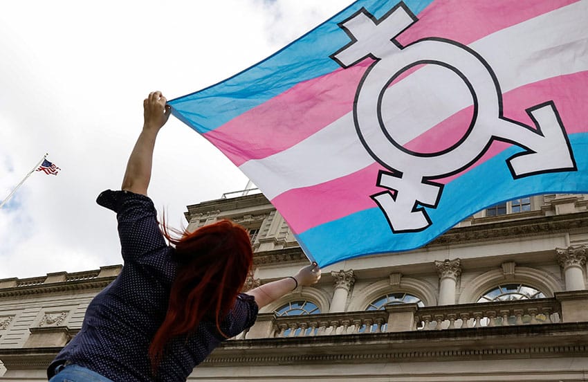 A New Yorker holds a transgender flag. In 2021 the Biden administration appealed a ruling protecting medical personnel from having to carry out gender-transition procedures against their conscience and professional medical judgement. Photo: CNS, Brendan McDermid, Reuters