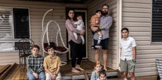 Deena and Joshua Portelli with their children at their home in Mt Druitt. Photo: Alphonsus Fok