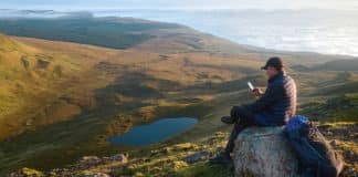 A hiker rests in the Scottish highlands. Travel and journeys are important - for the spirit and our outlook on life. Photo: 123rf