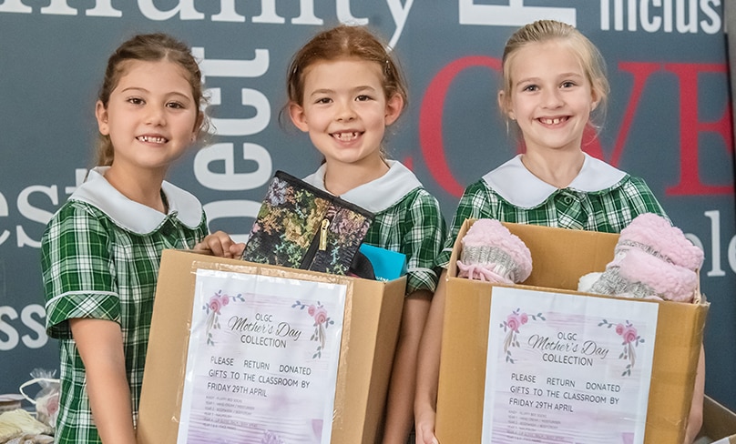 Rather than receive gifts this year, mums at Our Lady of Good Counsel worked with their children to give gifts to women staying in local shelters. Photo: Giovanni Portelli