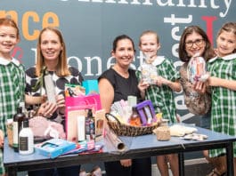 Rather than receive gifts this year, mums at Our Lady of Good Counsel worked with their children to give gifts to women staying in local shelters. From left: Grace Smith and mum Georgie, Alanna and daughter Lola Nicols, Nicole and her daughter Aria Clancy. Photo: Giovanni Portelli