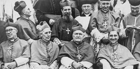 Archbishop Andrew Killian of Adelaide, front left, Archbishop Daniel Mannix of Melbourne, Archbishop Michael Kelly of Sydney and Apostolic Nuncio Archbishop Giovanni Panico relax as they wait to have their photograph taken at the Fourth Plenary. Photo: Archdiocese of Sydney archives