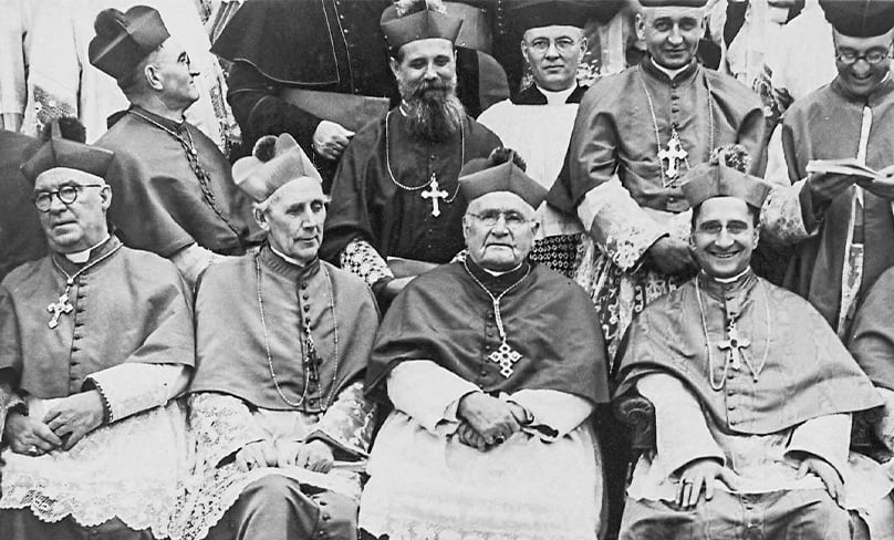 Archbishop Andrew Killian of Adelaide, front left, Archbishop Daniel Mannix of Melbourne, Archbishop Michael Kelly of Sydney and Apostolic Nuncio Archbishop Giovanni Panico relax as they wait to have their photograph taken at the Fourth Plenary. Photo: Archdiocese of Sydney archives