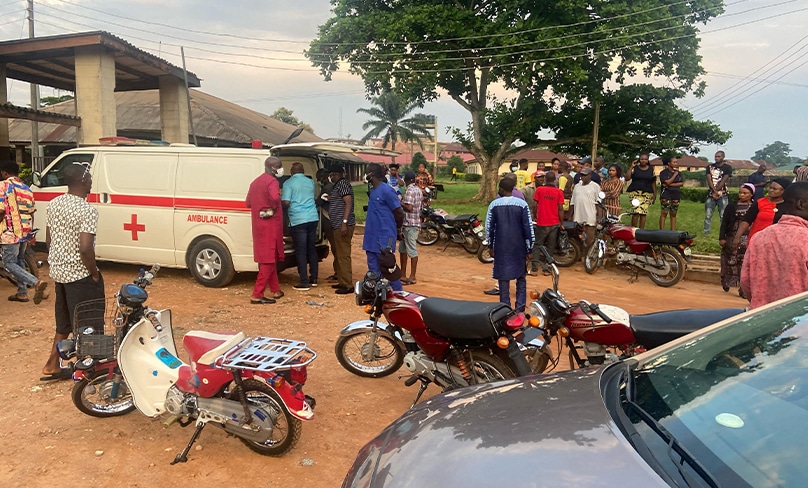 Relatives of churchgoers who were attacked by gunmen during Pentecost Mass at St Francis Xavier Church, gather as health workers attend to victims brought in by ambulance after the attack in Owo, Nigeria, June 5, 2022. PHOTO: CNS photo/ Reuters, Stringer