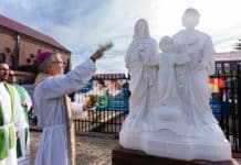 A 100-year milestone. Sydney Bishop Daniel Meagher blesses Holy Family Maroubra's new statue of its patrons last weekend. Photo: Patrick J. Lee